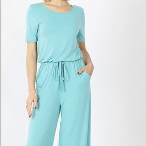 Women’s jumpsuit.  Color grey and mint.